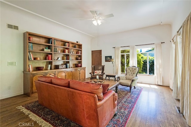 living room with ceiling fan and hardwood / wood-style floors