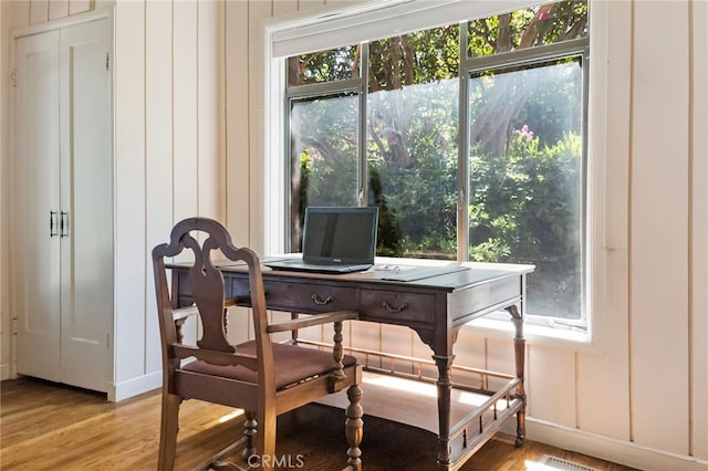 office with light hardwood / wood-style floors