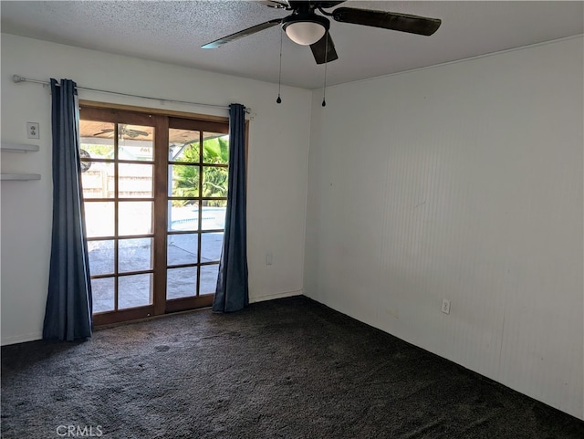 unfurnished room featuring ceiling fan, a textured ceiling, and carpet floors