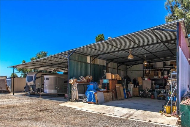 view of vehicle parking featuring a carport