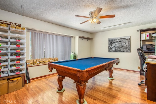 game room with ceiling fan, billiards, a textured ceiling, and light hardwood / wood-style floors