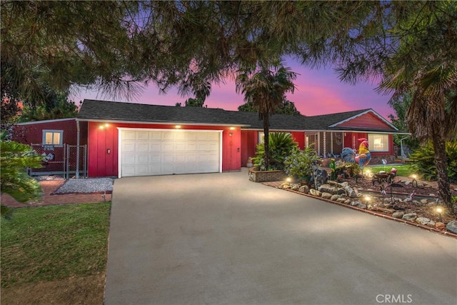 ranch-style home featuring a garage