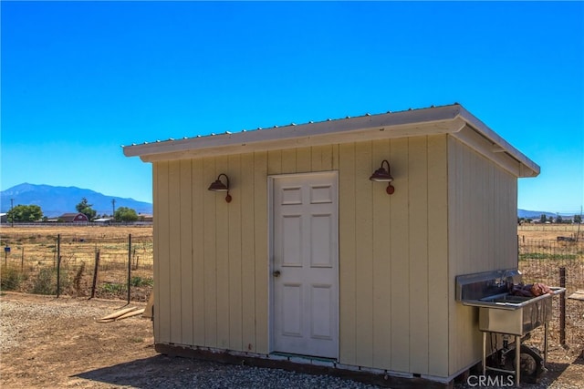 view of outbuilding with a mountain view