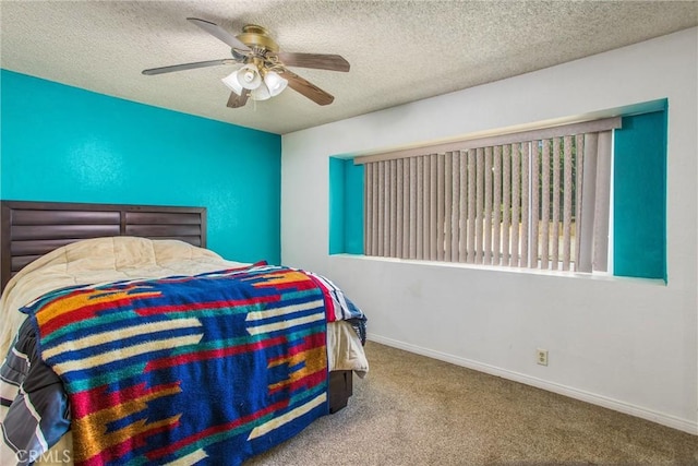 carpeted bedroom featuring baseboards and a textured ceiling