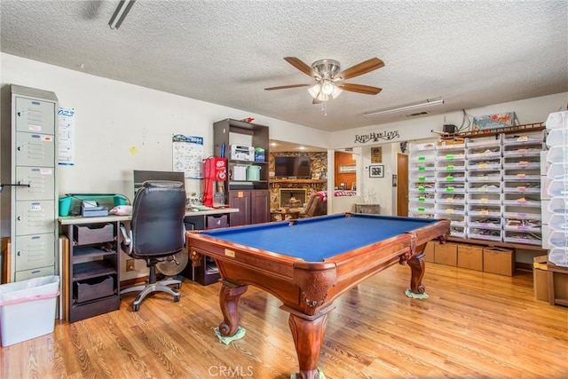 playroom featuring billiards, a textured ceiling, a ceiling fan, and wood finished floors