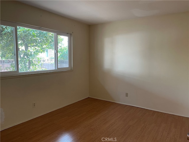 empty room featuring hardwood / wood-style flooring