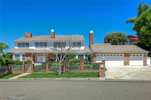 view of front of home featuring a garage, concrete driveway, brick siding, and a fenced front yard