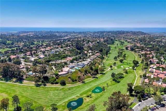 drone / aerial view featuring a water view and golf course view