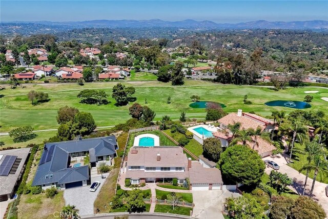 birds eye view of property featuring a mountain view