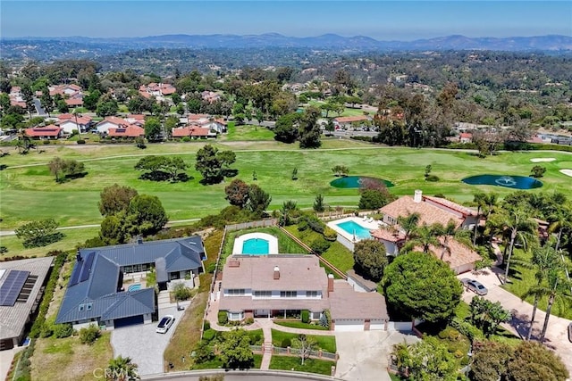 aerial view featuring a residential view, a mountain view, and golf course view