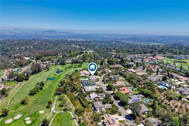 aerial view featuring a residential view, a mountain view, and golf course view