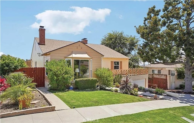 view of front facade with a front lawn and a garage