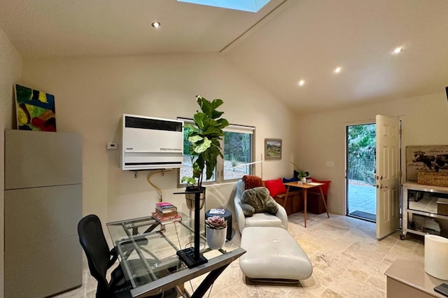 interior space with vaulted ceiling with skylight and a wall mounted AC