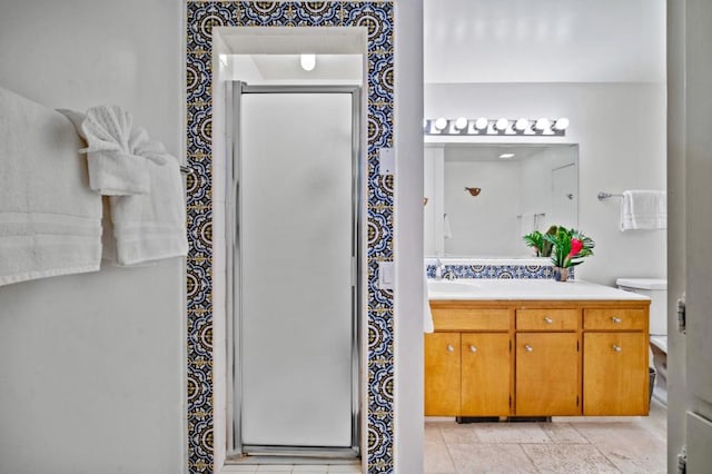 bathroom with an enclosed shower and vanity