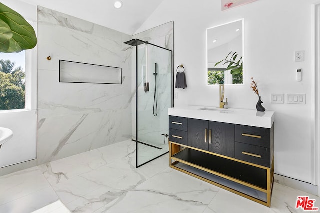 bathroom with vanity, a healthy amount of sunlight, vaulted ceiling, and tiled shower