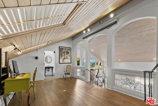 interior space featuring wood ceiling, vaulted ceiling, and wood-type flooring