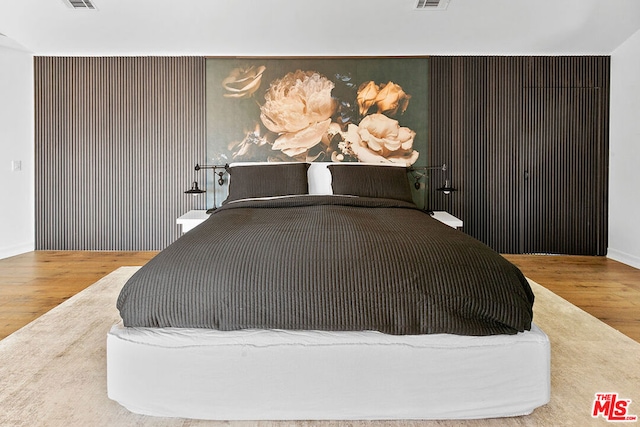 bedroom featuring hardwood / wood-style flooring