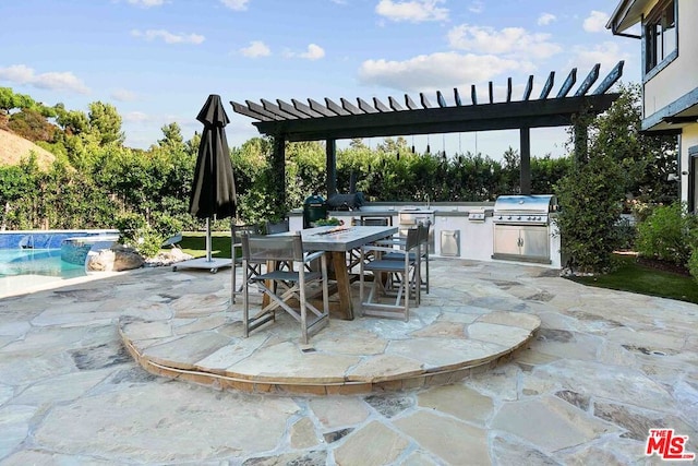 view of patio / terrace featuring a pergola, exterior kitchen, and grilling area