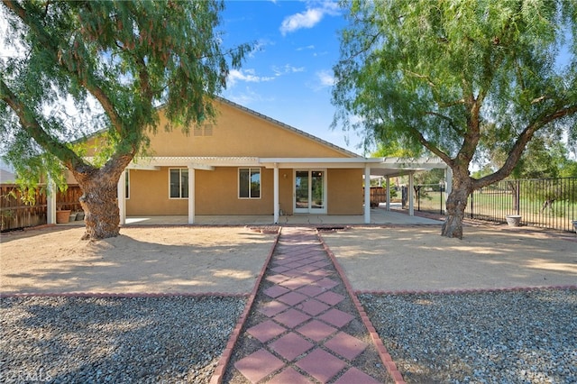 back of property featuring a patio area