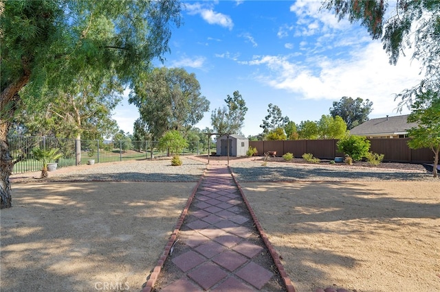 view of yard featuring a storage unit