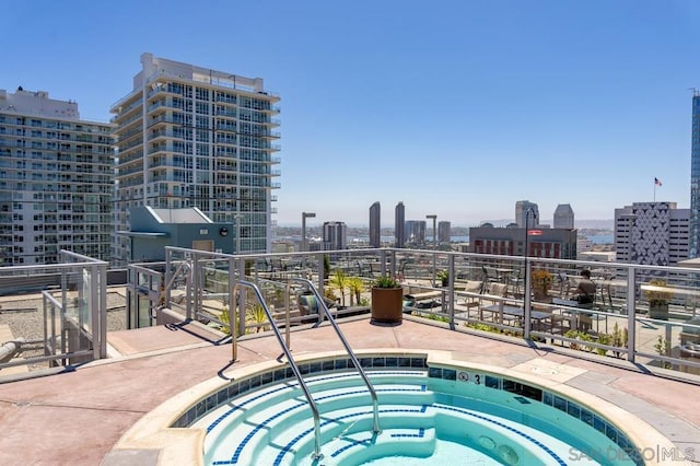 view of pool featuring a hot tub