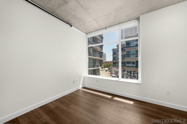 unfurnished room featuring hardwood / wood-style floors