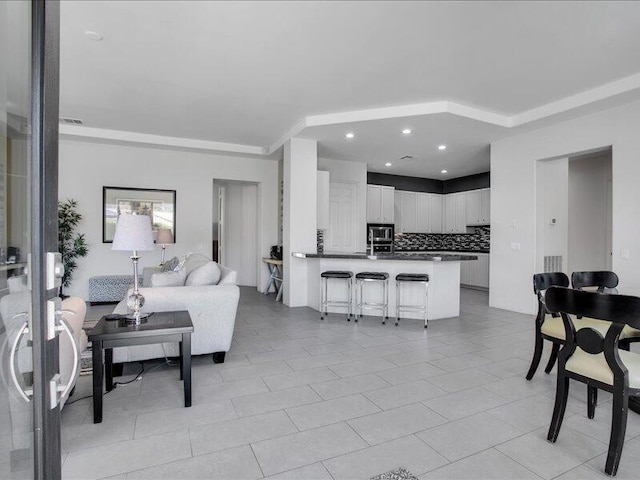 living room with light tile patterned flooring