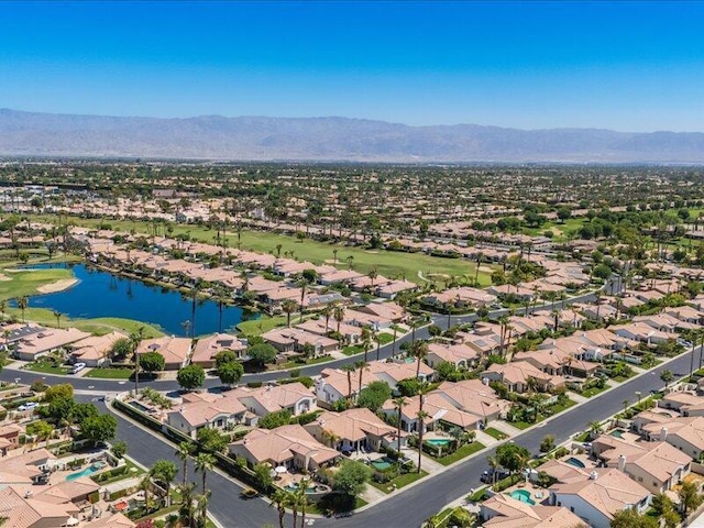 birds eye view of property featuring a water and mountain view