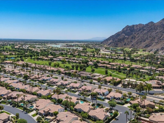 birds eye view of property featuring a mountain view