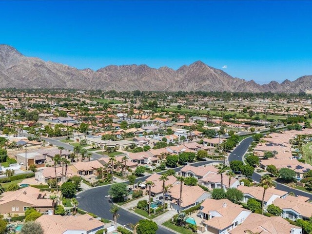 birds eye view of property featuring a mountain view