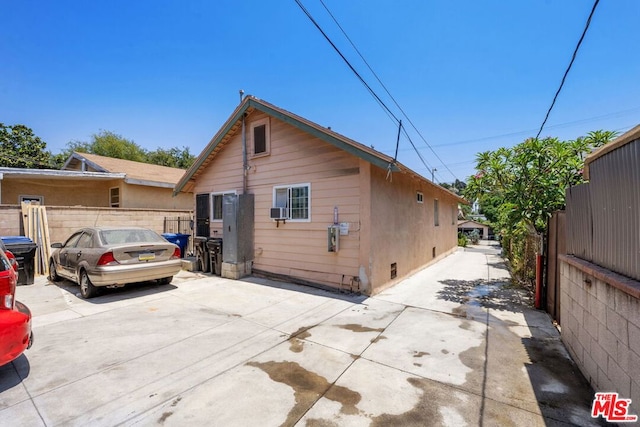 rear view of property featuring a patio area