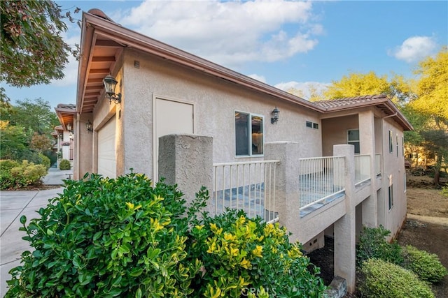 view of side of property with a garage