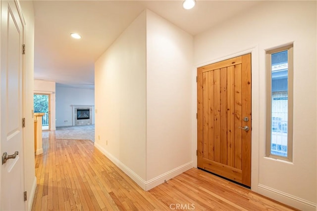 10 Hidden Brooke Way, Chico, CA 95928 - foyer entrance with light wood-type flooring, recessed lighting, and a glass covered fireplace