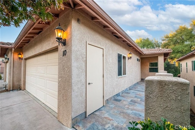 view of property exterior featuring a garage