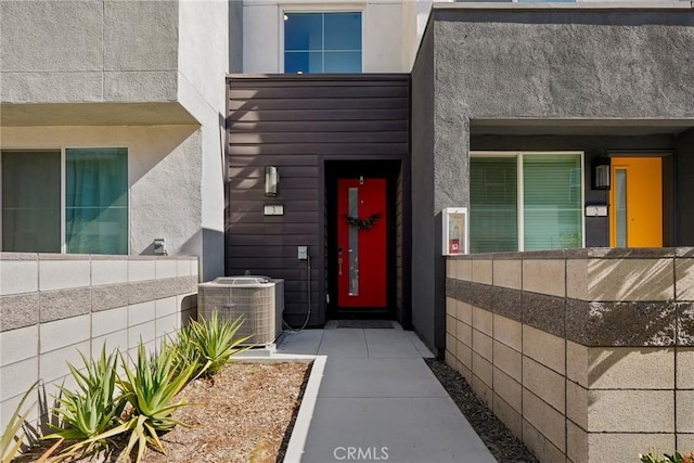 doorway to property with central AC unit