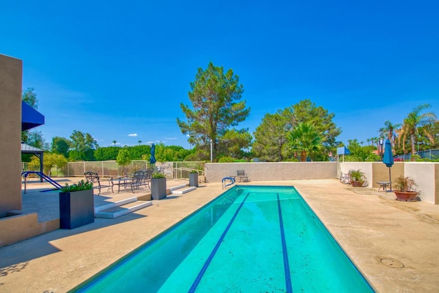 view of pool featuring a patio area