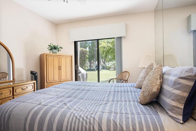 bedroom with ceiling fan and access to outside