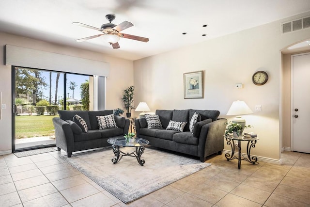 living room with ceiling fan and light tile patterned floors