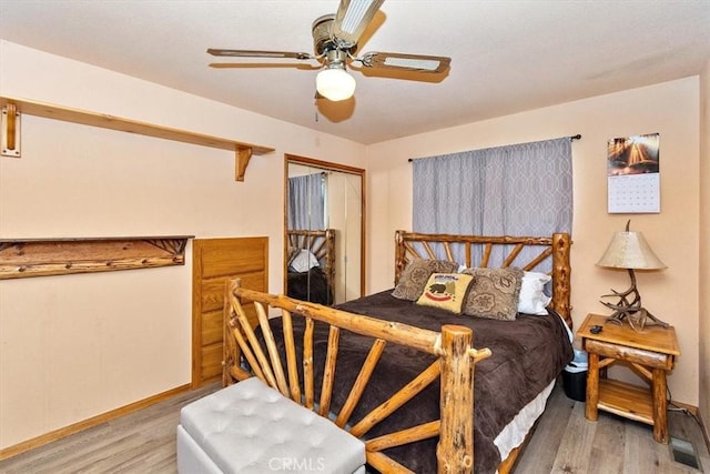 bedroom with ceiling fan and light hardwood / wood-style floors