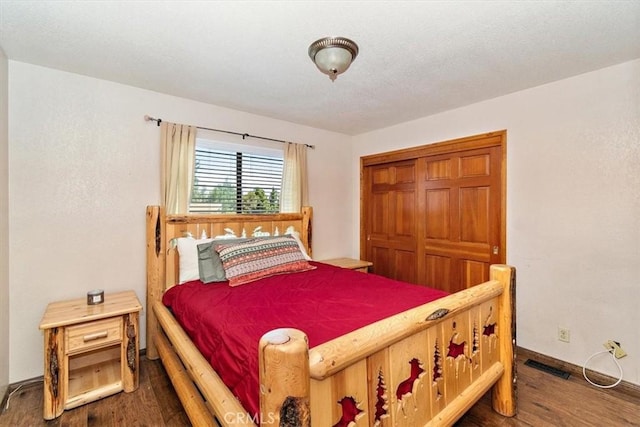 bedroom featuring dark wood-type flooring