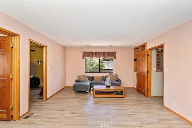 living room with light hardwood / wood-style flooring