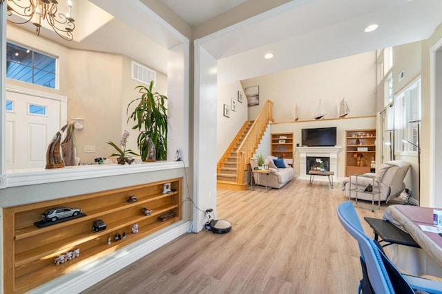 office space featuring hardwood / wood-style flooring and a notable chandelier