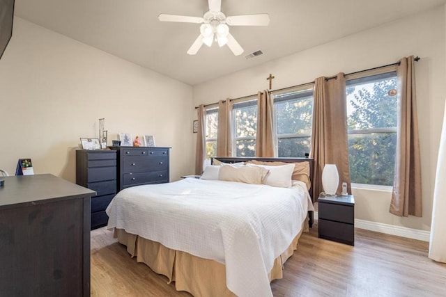 bedroom featuring light wood-type flooring and ceiling fan