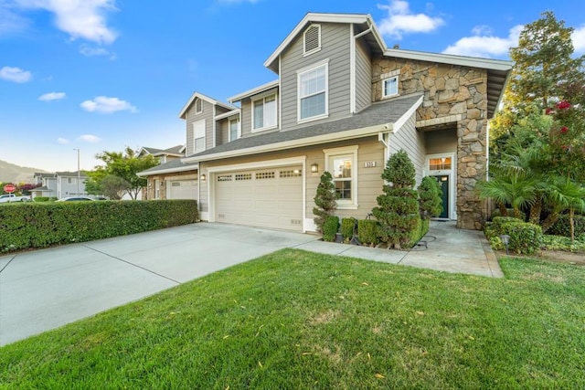 view of front facade with a garage and a front lawn