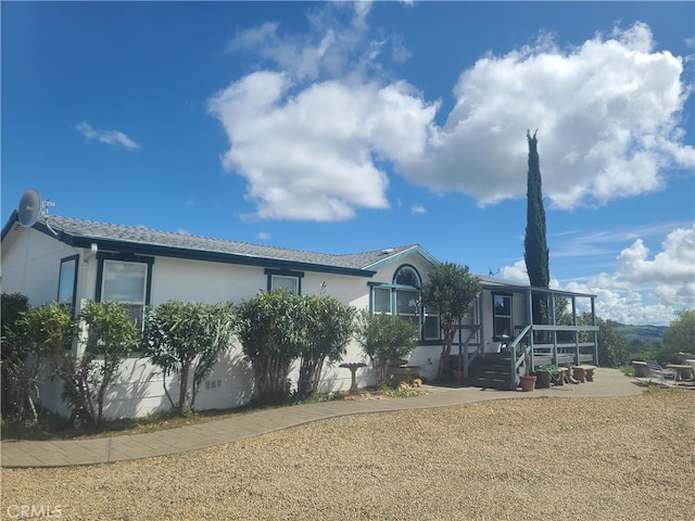 view of front of home featuring a patio