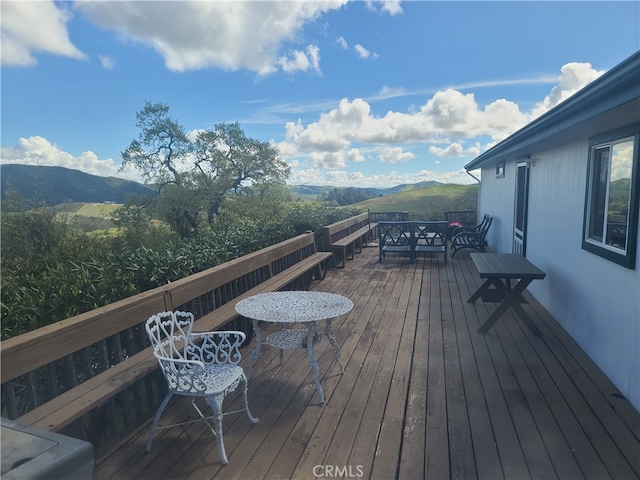 wooden deck featuring a mountain view