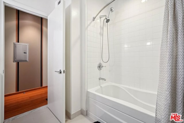 bathroom with shower / tub combo and tile patterned floors