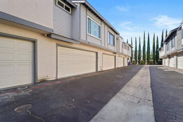 view of property exterior with a garage