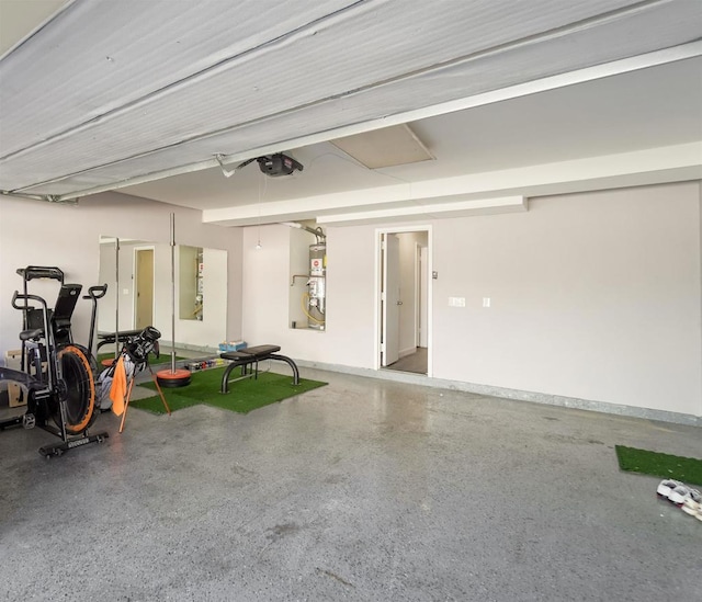 garage featuring a garage door opener and water heater