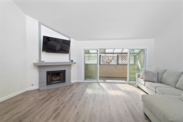 unfurnished living room featuring hardwood / wood-style flooring and a fireplace